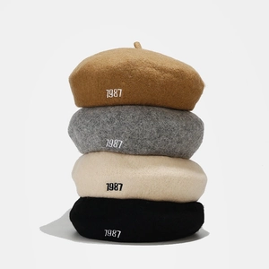 Classic wool 1987 embroidery beret in beige, grey, black, and camel colors