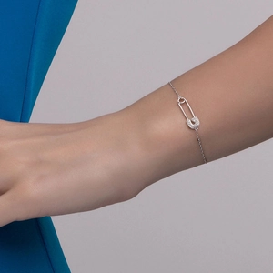 S925 sterling silver paperclip bracelet with pavé cubic zirconia on model's wrist