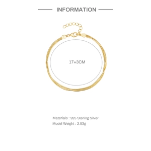 Detail view of gold 925 sterling silver triple layer snake chain bracelet with specs