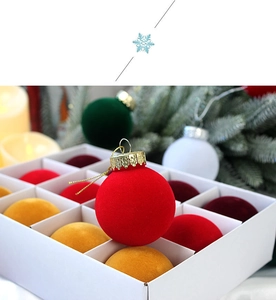 Detail of 12-piece colorful flocked Christmas ornaments in a white gift box for tree decor