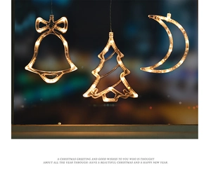 Hanging Christmas LED window lights in bell tree and moon shapes with warm white glow