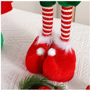 Detailed macro view of Christmas elf plush boots with festive red and green fabric textures