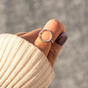 Minimalist S925 sterling silver ring with sparkling pavé cubic zirconia on model hand