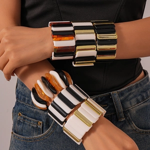 Wide geometric acrylic block bracelet set with black, white, and amber resin patterns