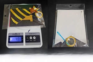 Detail of Happy New Year banner kit with weights and gold glitter card accessories