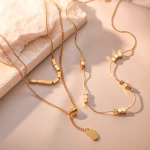 Minimalist layered gold-plated titanium steel necklace with geometric beads and square tag