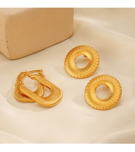 Detail of 18K gold plated hoop earrings with elegant textured vertical groove patterns
