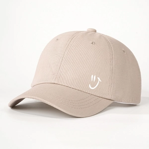 Classic beige cotton baseball cap with white embroidered smiley face and adjustable strap