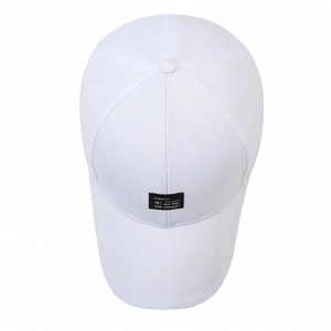 White cotton baseball cap with black letter patch and curved brim for sun protection