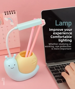 Detail of cute snail LED desk lamp with flexible neck and integrated pencil holder