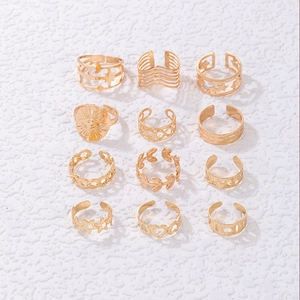 12pcs set of golden bohemian rings featuring star, moon, leaf, and geometric heart patterns