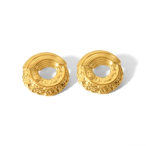Detailed macro view of 18K gold-plated round earrings with striped and hammered textures