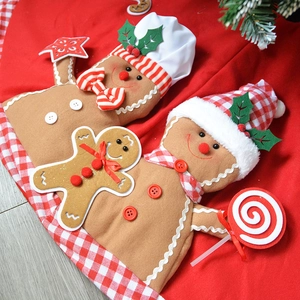 Gingerbread man plush Christmas tree skirt with festive red ruffles and 3D doll figures
