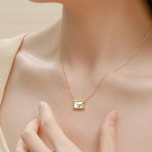 Exquisite S925 silver envelope locket necklace with heart detail worn by a model