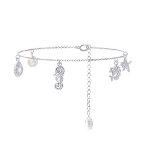 Macro detail of S925 sterling silver sea animal charms including seahorse and starfish