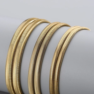 Flat gold snake bone necklace in three widths made of polished stainless steel