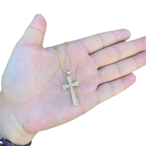 Iced out copper cross pendant necklace with 18K gold plating and micro-pave cubic zirconia