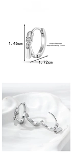 Detail view of silver zipper charm earrings with cubic zirconia and size measurements