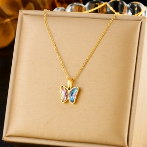 Elegant gold butterfly necklace with gradient colorful crystal pendant on soft padding