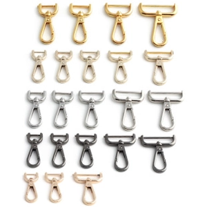 Macro view of assorted metal spring buckles and D-rings for DIY handbag accessories