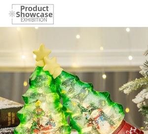 Macro detail of green Christmas tree music box with internal snowman and LED snow globe