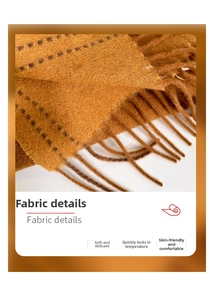 Macro view of thick brown wool scarf showing soft knit texture and fringe edge detail
