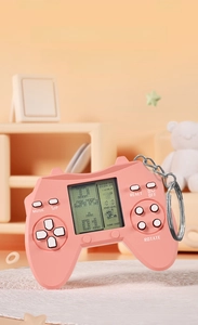 Close-up of pink mini handheld Tetris game console with a silver metal keychain