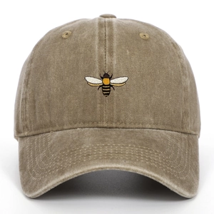 Vintage washed khaki baseball cap featuring detailed bee embroidery in a classic 6-panel style