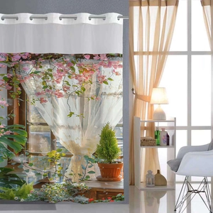 Detail of digital print shower curtain with pink bougainvillea pattern and metal rings