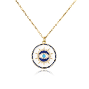 Golden necklace with blue evil eye pendant surrounded by radiant crystal stones
