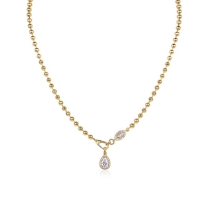 Detailed view of gold beaded chain with teardrop and marquise white zircon pendants