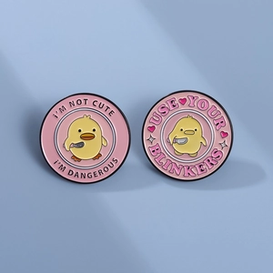 Enamel pins set with cute yellow duck holding a knife and funny English slogans