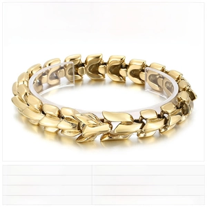 Macro detail of men's punk style dragon bone bracelet in gold vacuum plated stainless steel