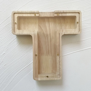 Detail of letter T oak wood money box with transparent acrylic cover and screw fixings