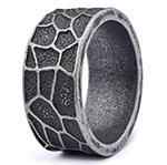 Macro shot of vintage silver ring featuring wide giraffe texture and oxidized steel finish
