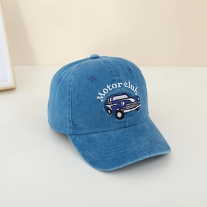 Detail of blue denim kids baseball cap with white Motor Club embroidery and car pattern