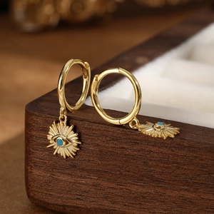 Bohemian gold S925 silver hoop earrings with blue stone evil eye charms on wood