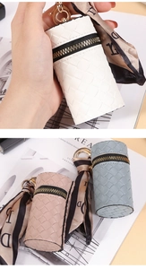 Detailed view of woven PU leather lipstick pouches in white, pink and grey blue colors