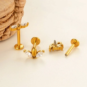 Golden marquise zircon flat back labret studs for ear and lip piercing on a stone base