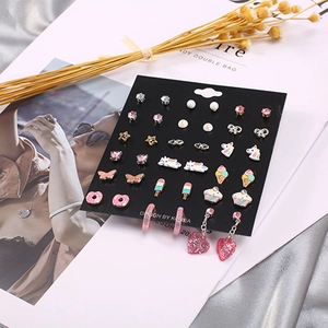 20 pairs of colorful kids stud earrings with donut and unicorn charms on a display card