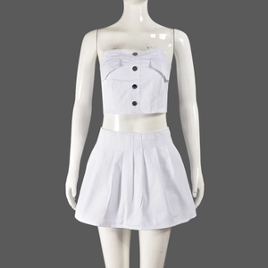 Front view of white two-piece set featuring a tube top with buttons and pleated mini skirt
