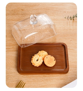 Detailed view of rectangular acacia wood butter dish with a transparent glass lid cover