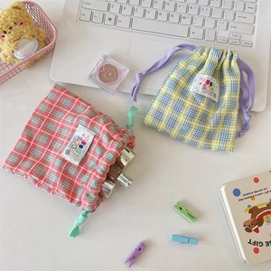 Colorful plaid drawstring storage pouches for makeup and travel accessories