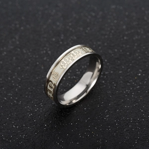 Glow in the dark stainless steel ring featuring a crown pattern and luminous inlay