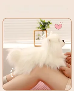 Close-up of soft white plush dog toy sitting on a lap in a cozy home setting