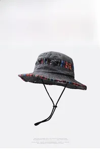 Detail of vintage washed cotton bucket hat with ethnic pattern trim and windproof cord