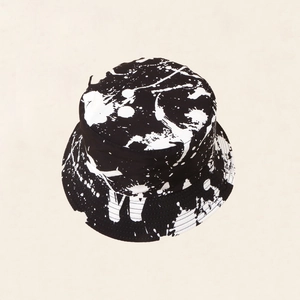 Modern black bucket hat with white artistic paint splatter design and a letter W embroidery