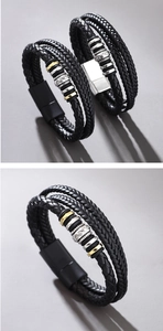 Detail view of multi-layer black braided leather bracelet with silver and gold metal beads