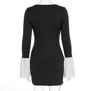 Detail of contrast white bell sleeves on a black slim-fit mini dress for women