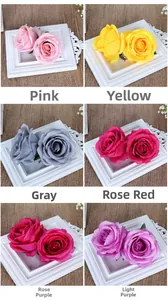 Detail view of artificial rose heads in six colors for wedding floral decorations